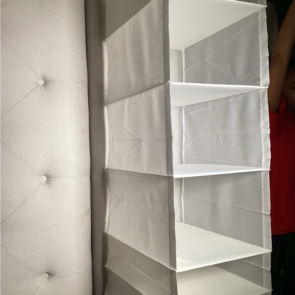 Shoe /clothing holder for closet holds 6 pair of shoes. Purchased from ikea